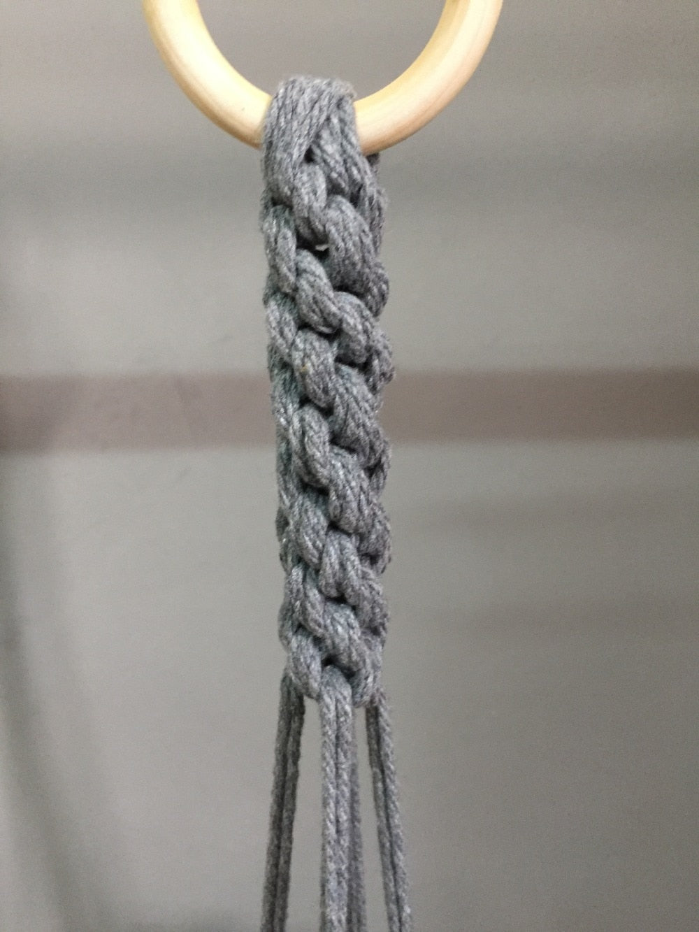 Plant support in colorful macrame