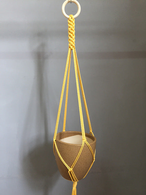 Plant support in colorful macrame