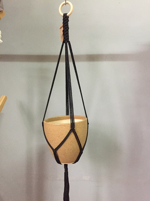 Plant support in colorful macrame